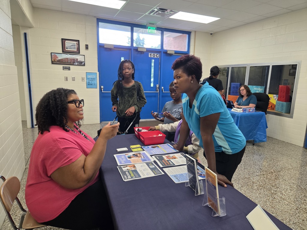 ForKids Representative talking with families.