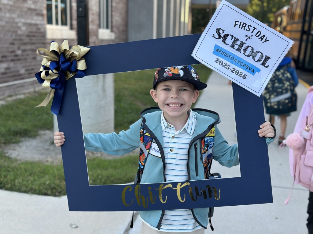 A boy excitedly smiling for his first day of school!