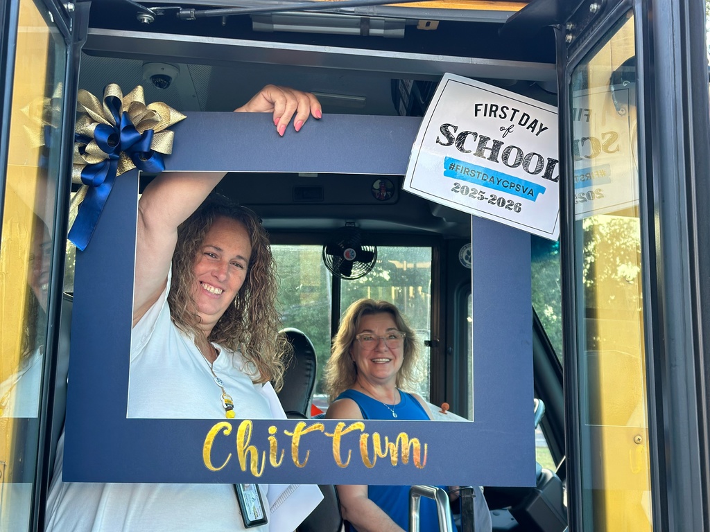 Bus drivers  smiling holding a first day of school frame with Chittum on it!