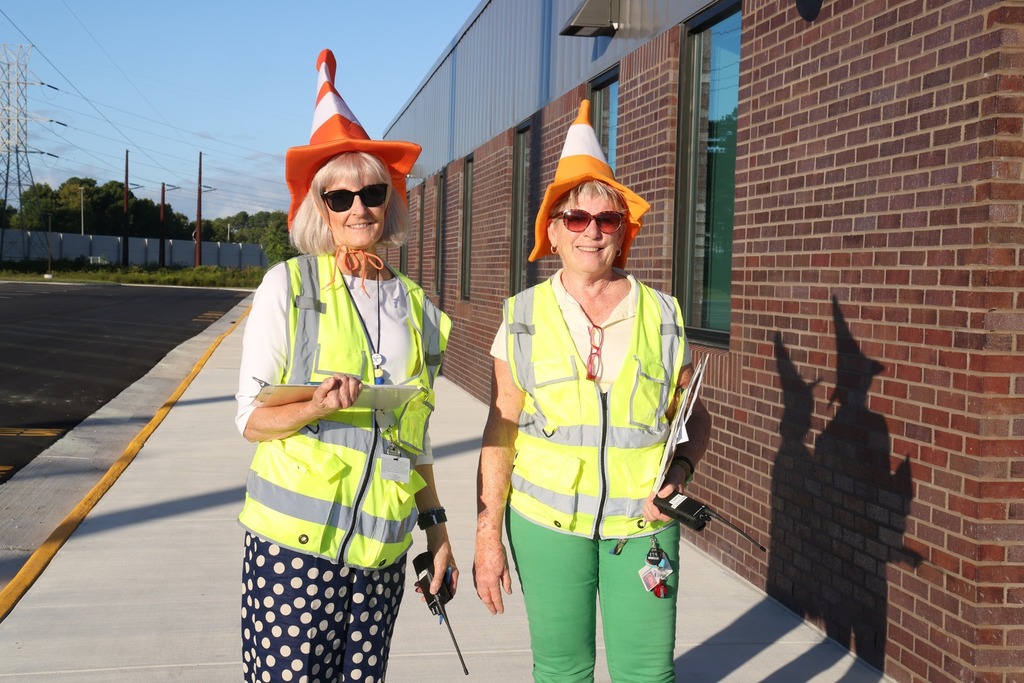 two bus patrol ladies with hats on