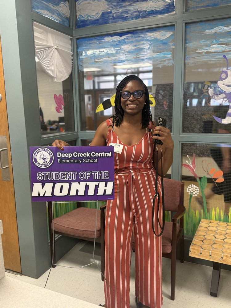 parent with Student of the month sign 