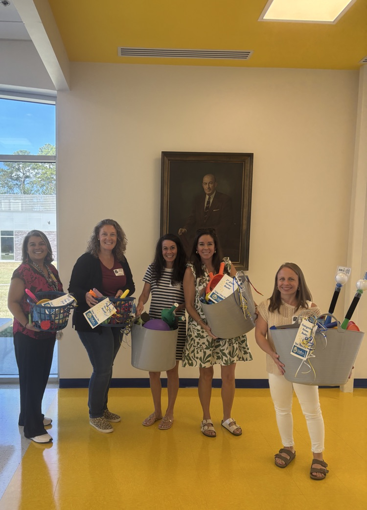 pta ladies holding baskets with recess equipment! 