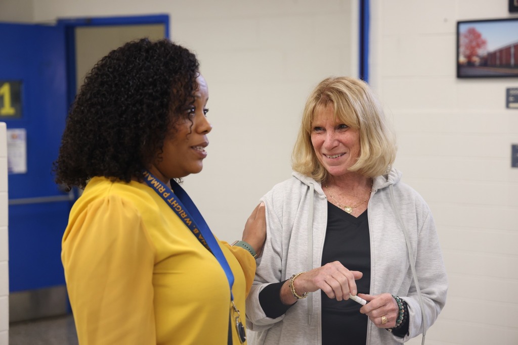 principal and teacher talking