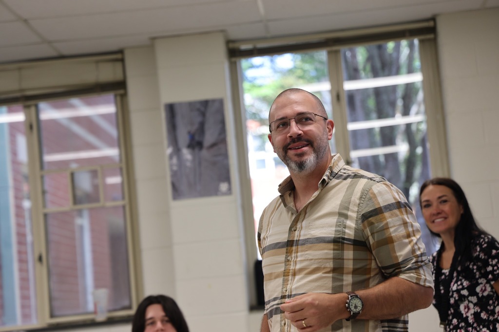 male teacher at front of class 