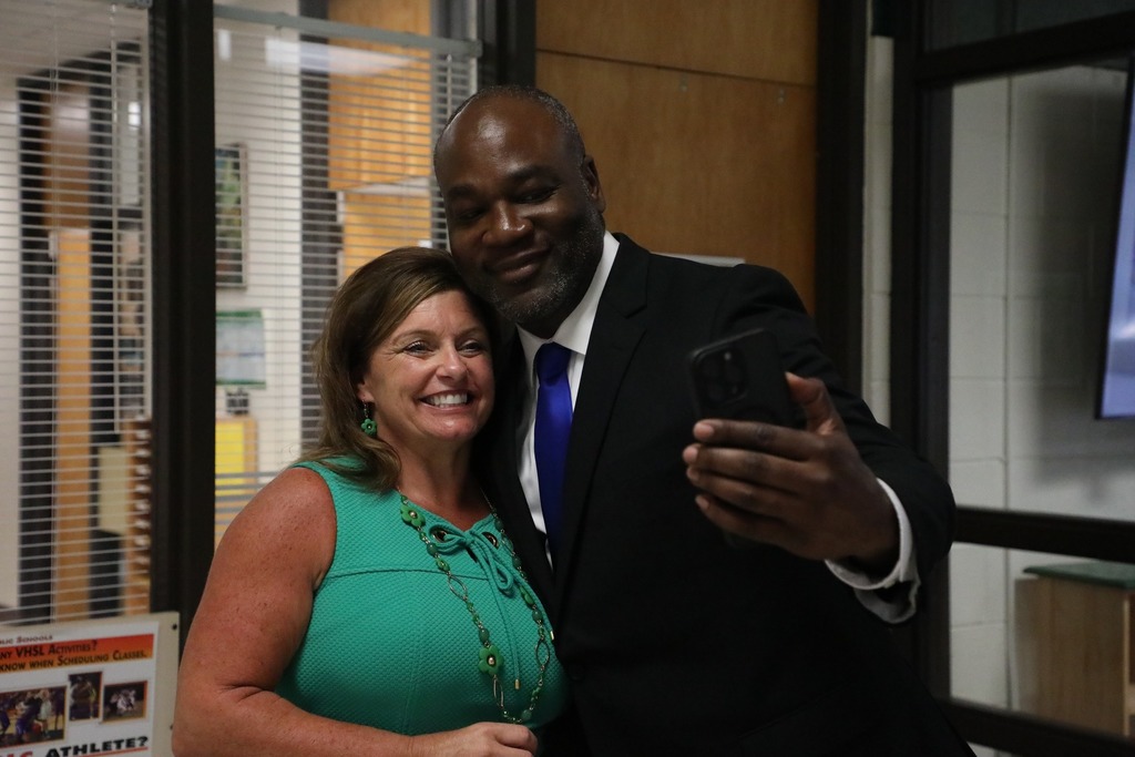 principal and administrator takng selfie