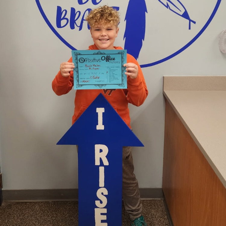 Buck with his positive Office referral paper and I RISE sign 