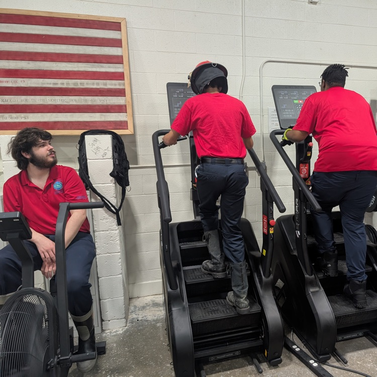 firefighting students on the stairclimber 