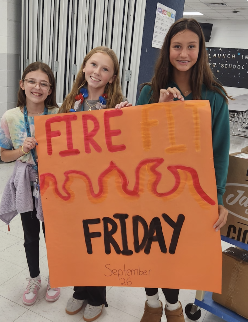 fire fit friday students holding poster