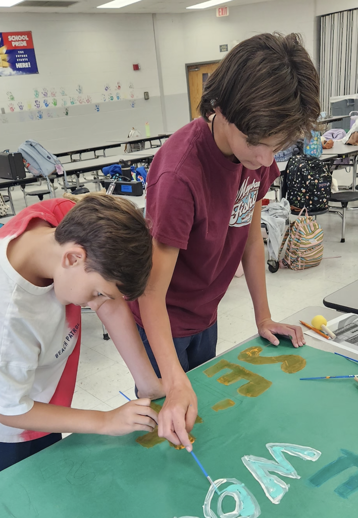 student making posters