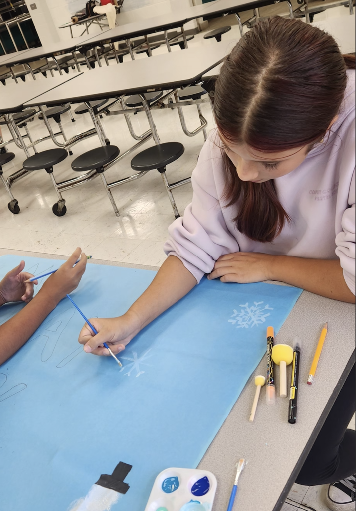 student making posters