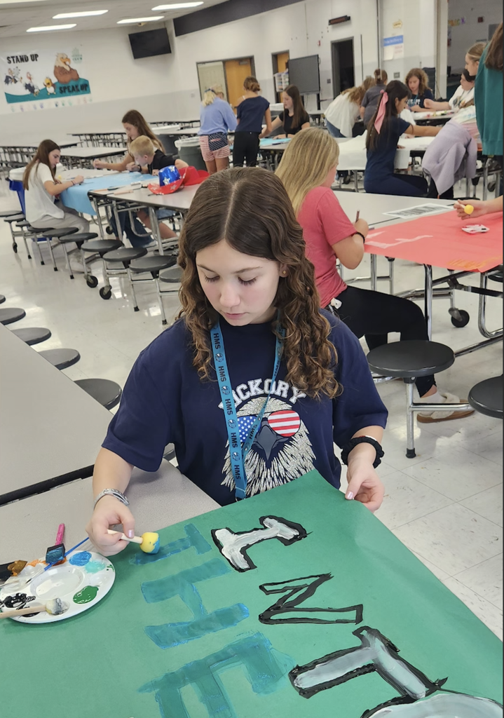 student making posters