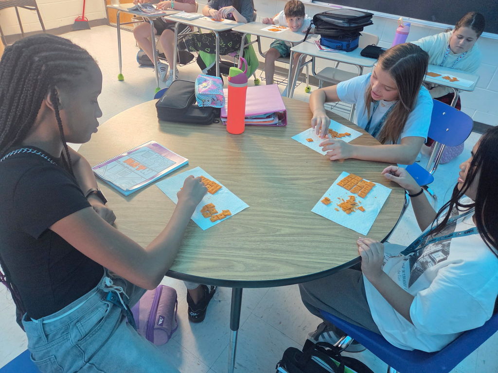 students in math working with cheese-its