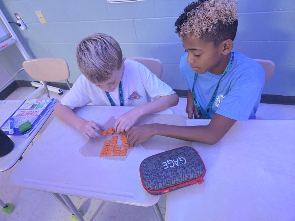 students in math working with cheese-its