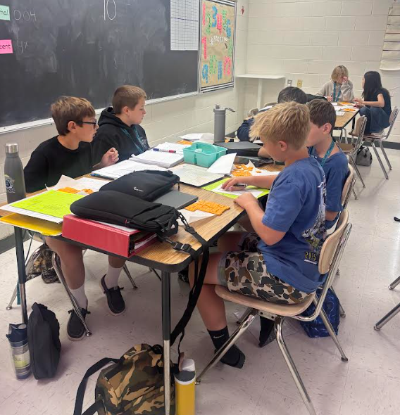 students in math working with cheese-its
