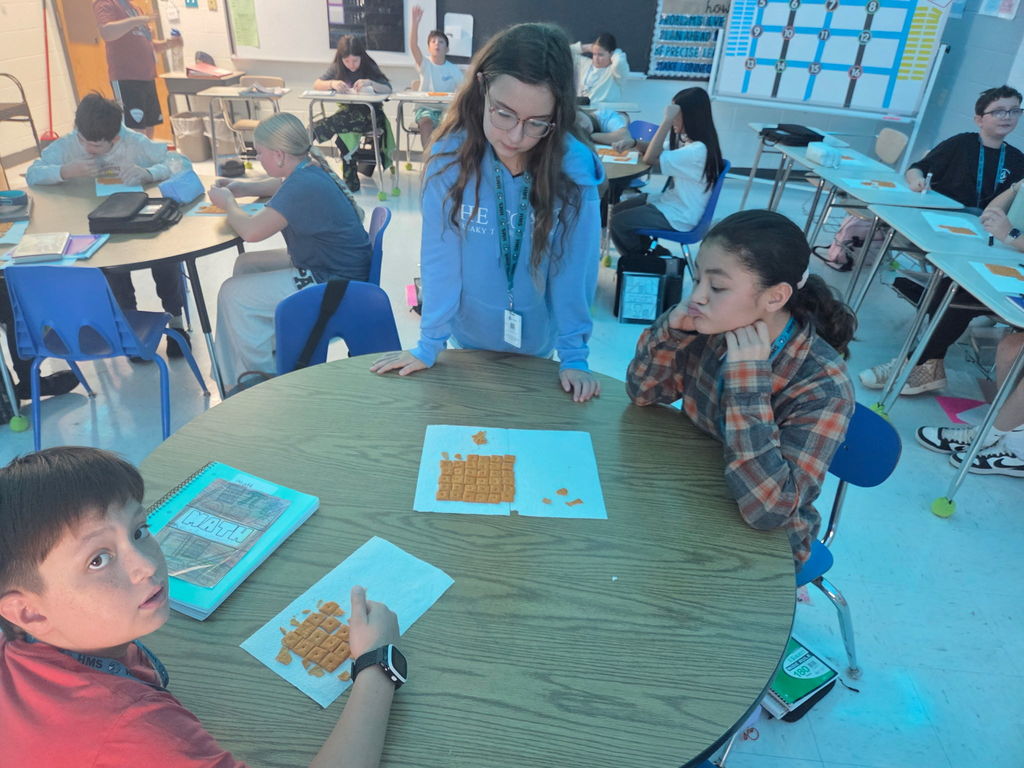 students in math working with cheese-its
