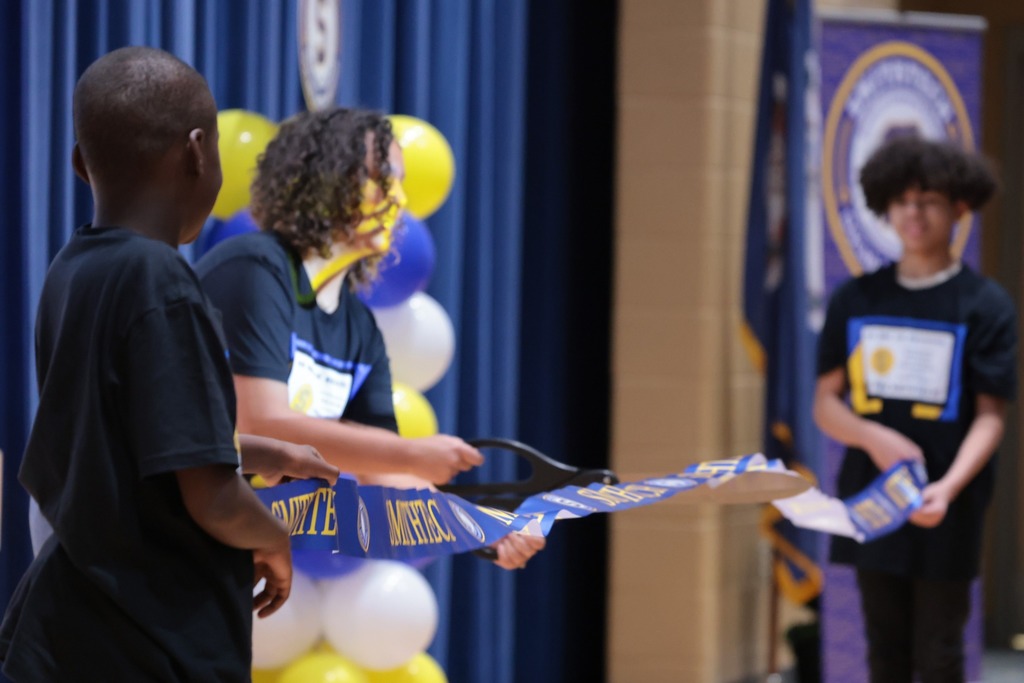 Cutting of SmithTech ribbon with 3 students