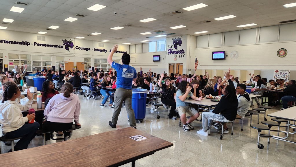 Scout Leader talking to students in cafeteria