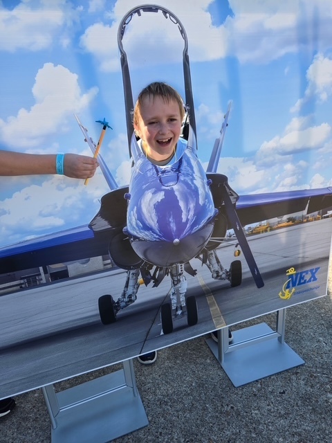 student's face in a plane poster