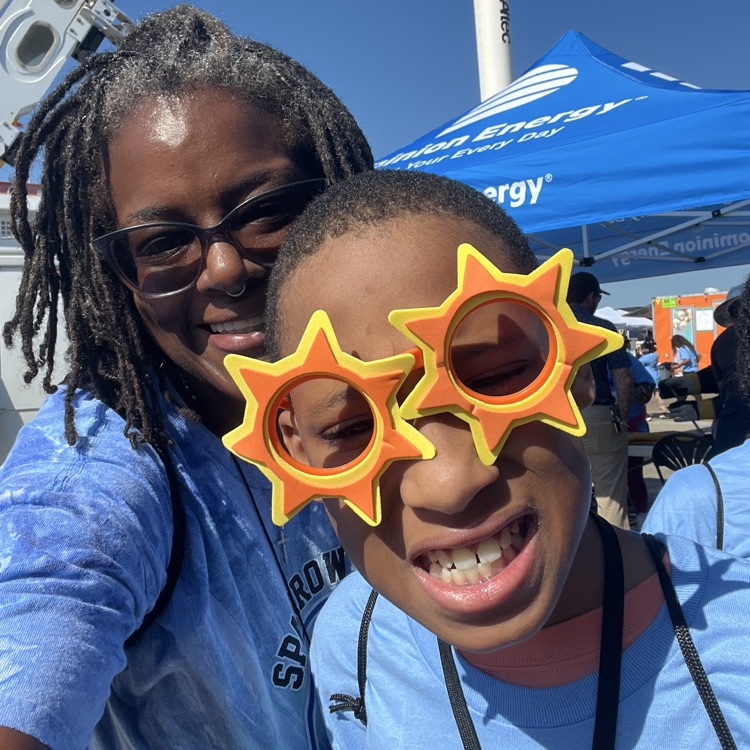 student and teacher with sun glasses