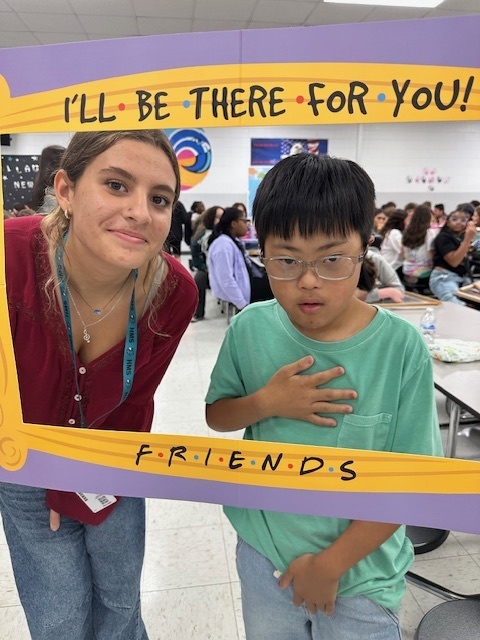 students in a frame that says "I'll Be There For You" Friends theme