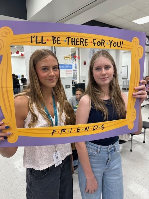 students in a frame that says "I'll Be There For You" Friends theme