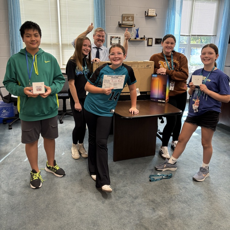 student winners in the principal office