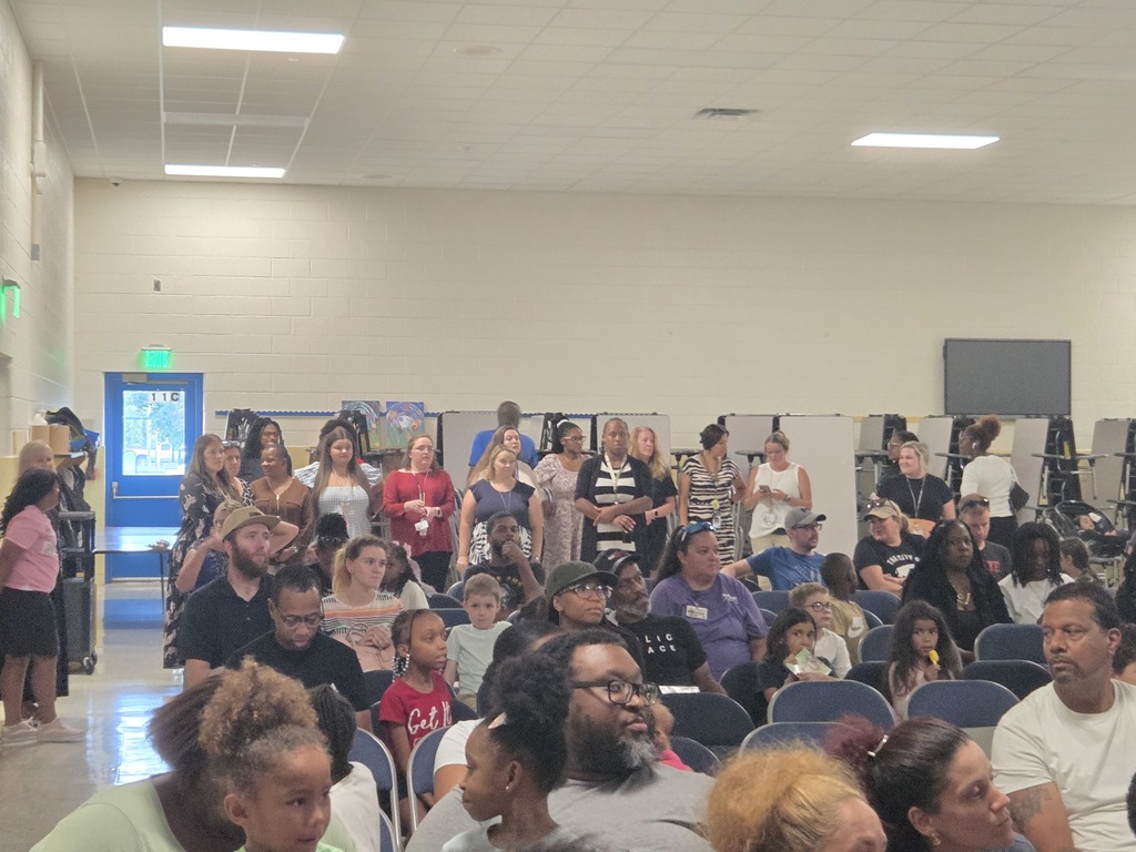 Teachers and parents listening to presentation