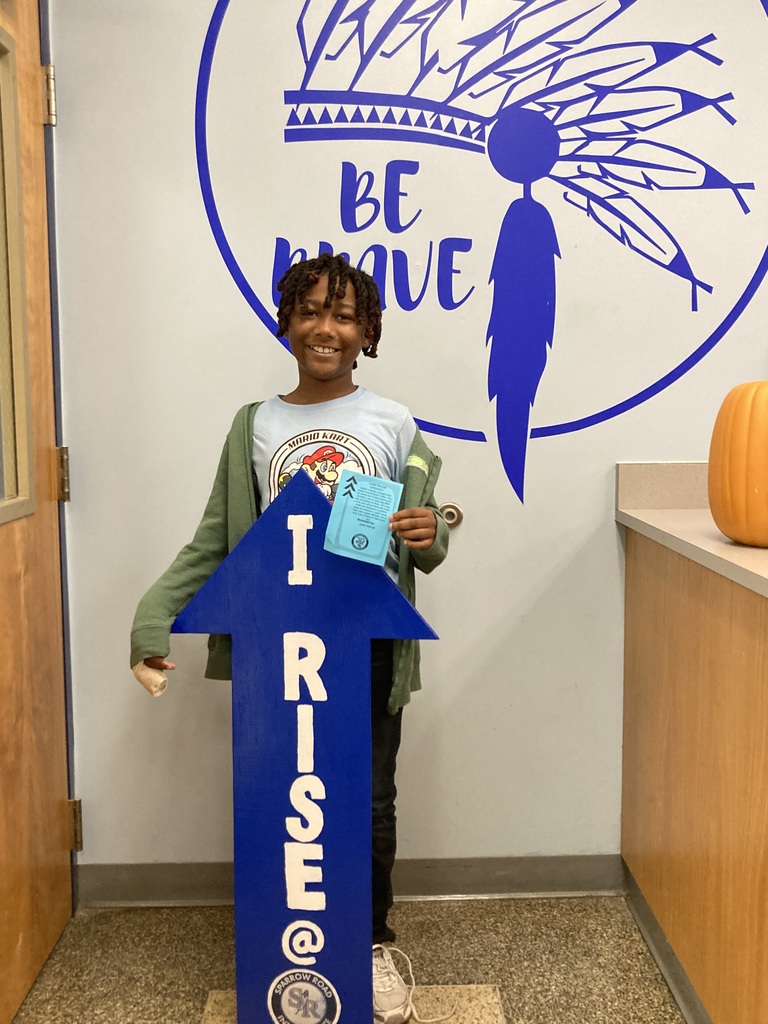 Student with RISE Recognition  sign