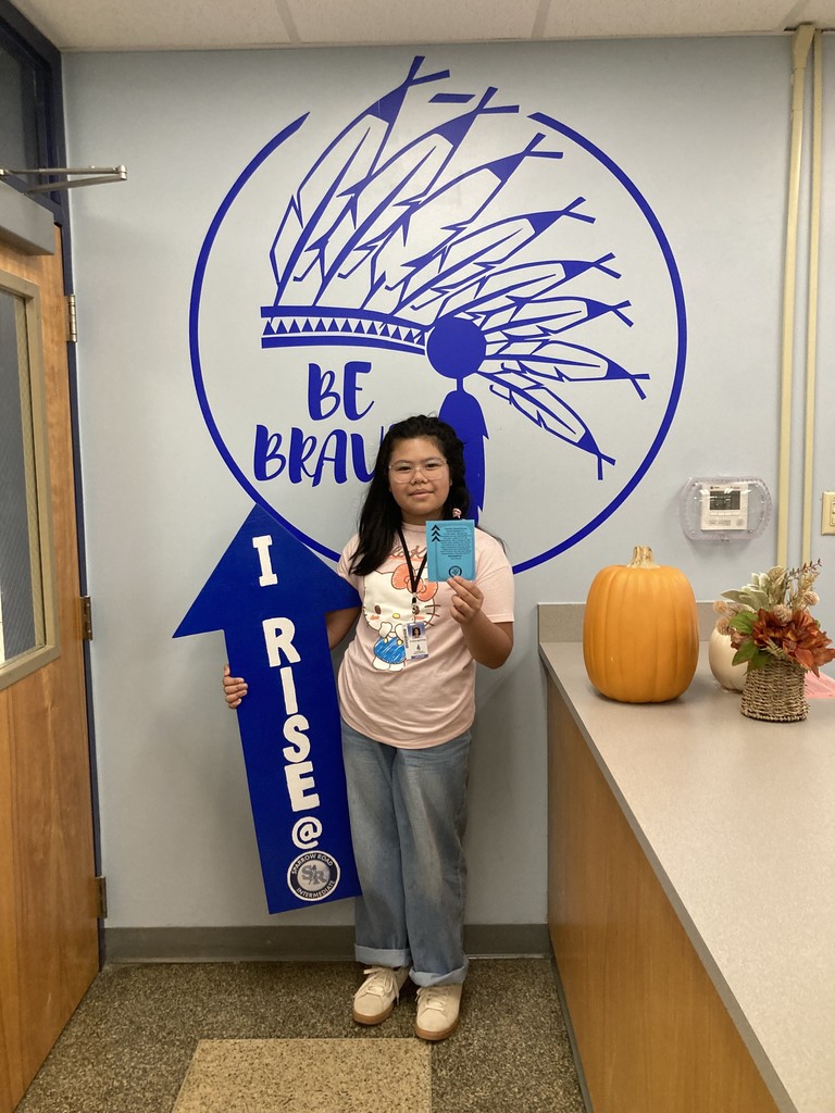 Student with RISE Recognition sign
