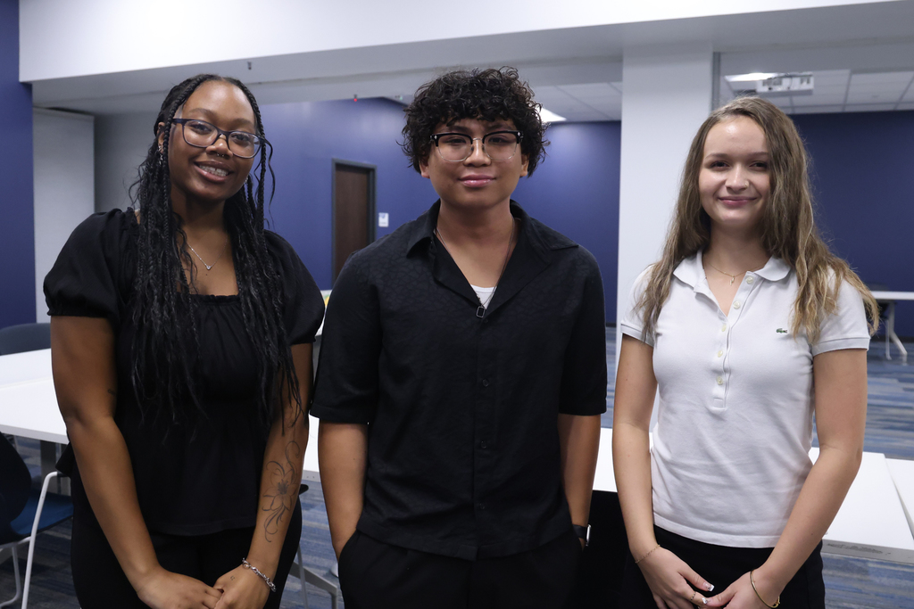 3 student leaders smiling for camera
