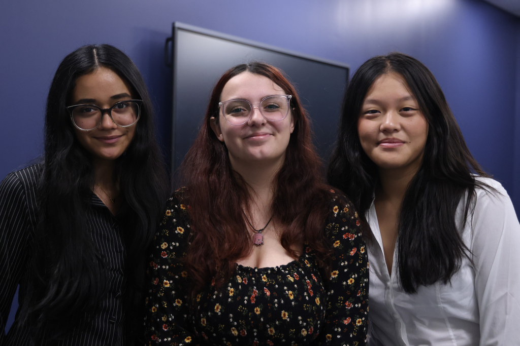 3 female student leaders smiling