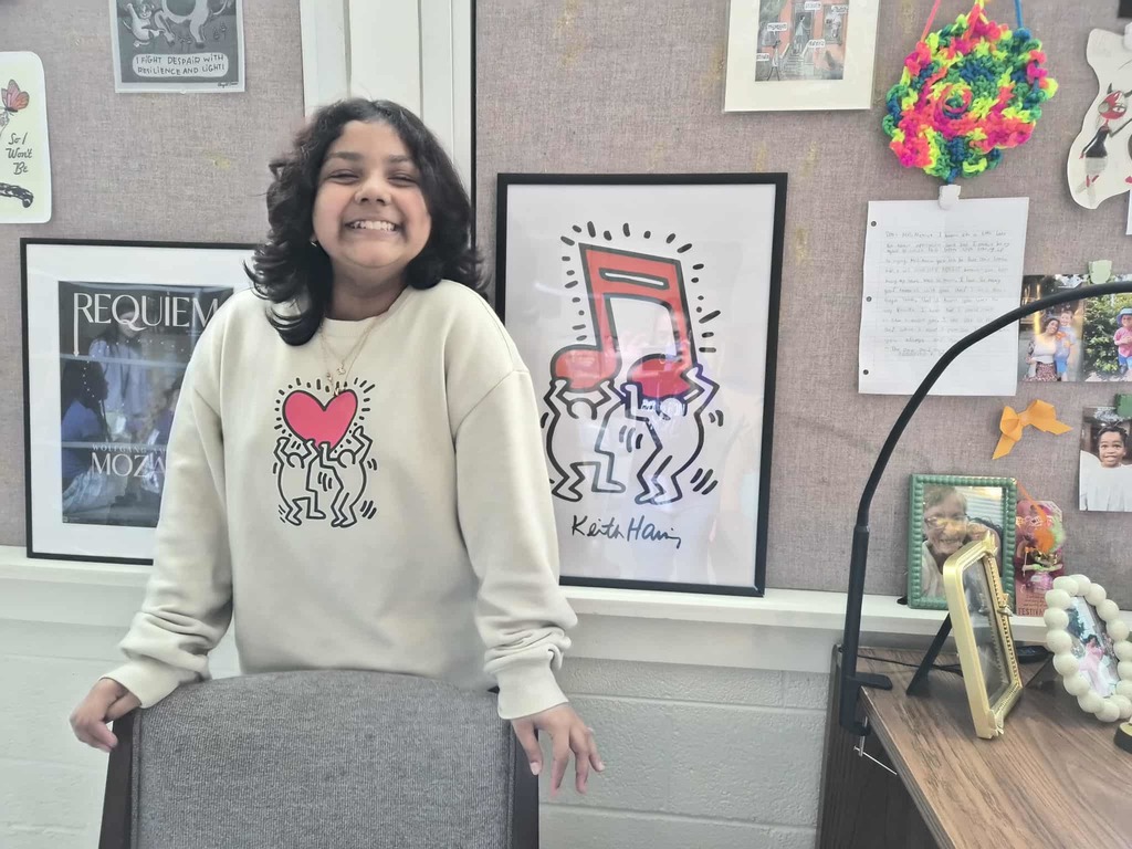 Smiling Girl with a heart sweatshirt!