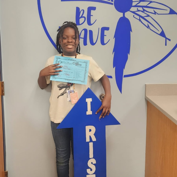 zyla with I RISE sign 