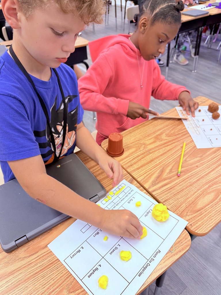 In Science, students had a great time exploring the different sizes of the planets. Students had to follow step-by-step directions to create the planets out of playdough and were amazed at just how much BIGGER the Gas Giants are compared to the Terrestrial planets.