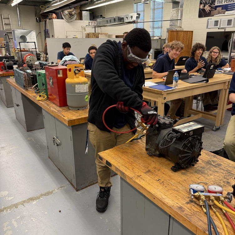 hvac students competing to connect manifold gauges 