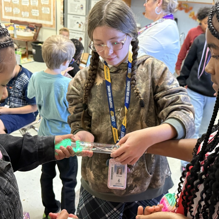 students holding energy stick together