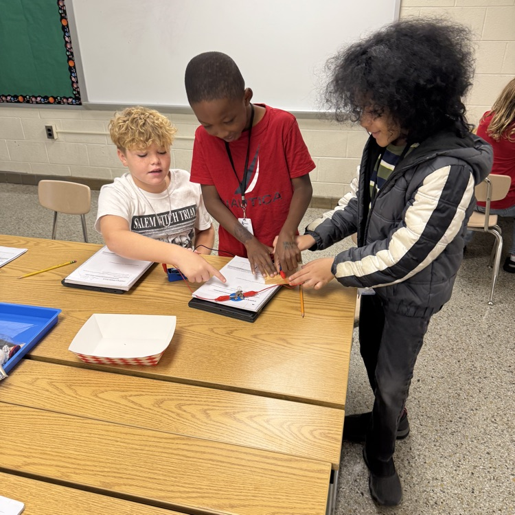 students working together to make a closed circuit