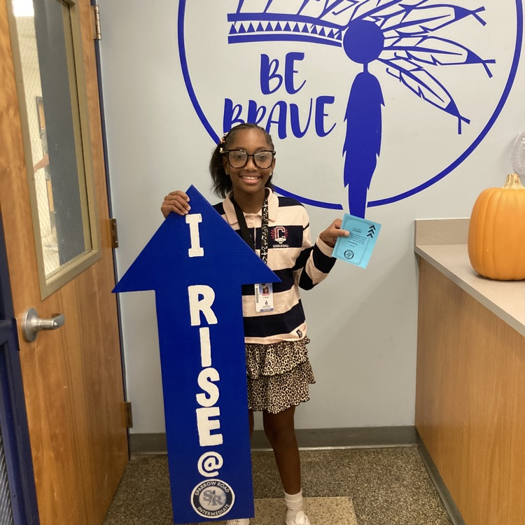 Student with I RISE sign