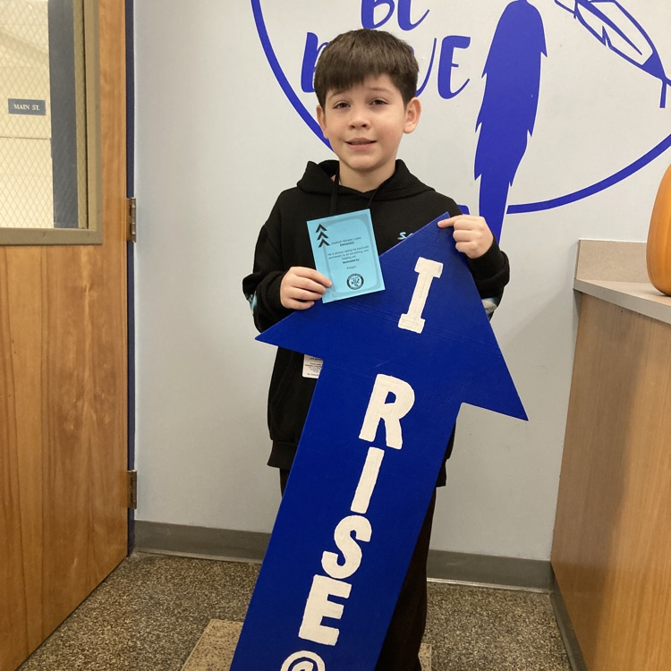 Student with I RISE sign