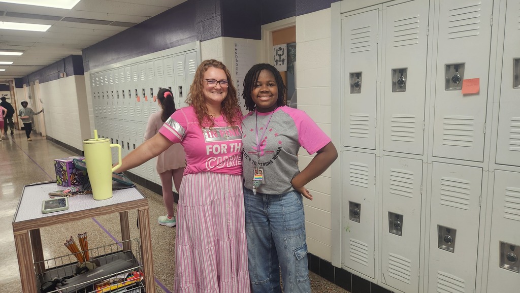 One teacher and one student in pink for spirit day