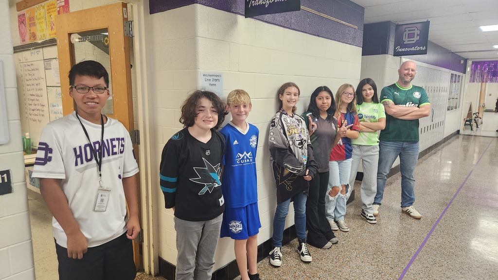 Students with Mr. Boyle wearing jerseys