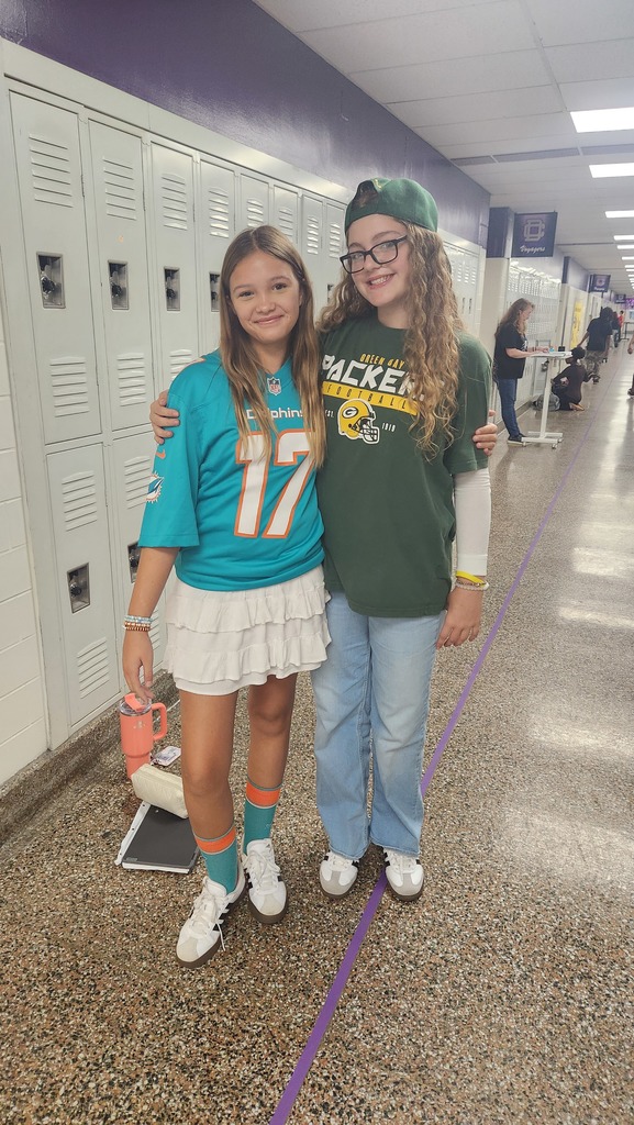 two girls wearing jerseys