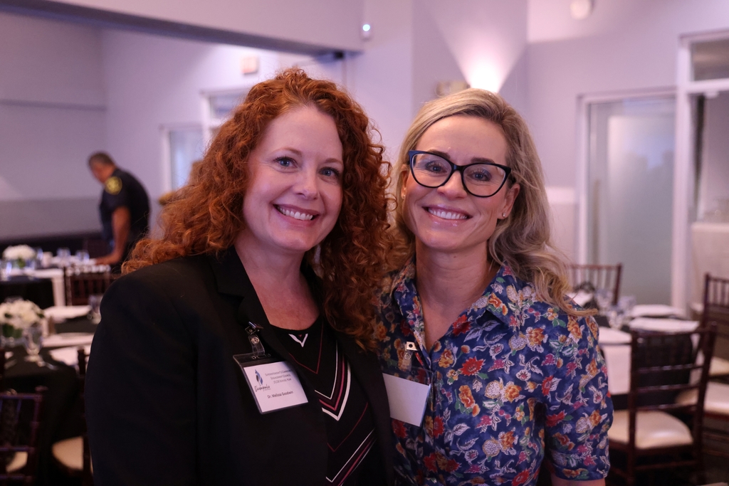 Melissa Goodwin and Caitlin Tucker smiling.