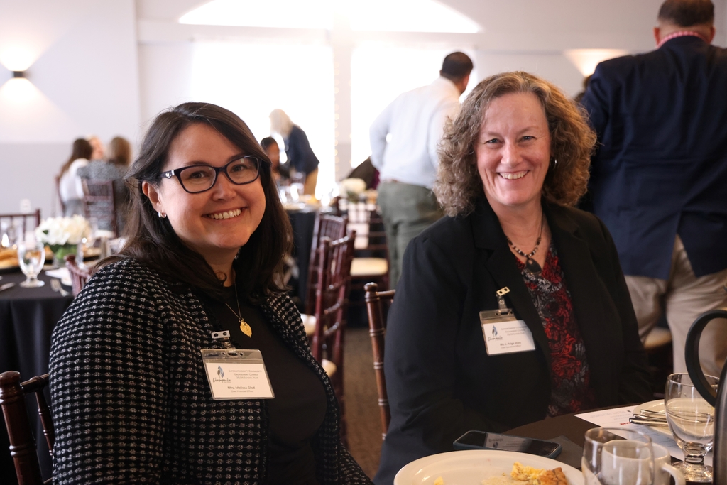 Administrative leaders smiling.