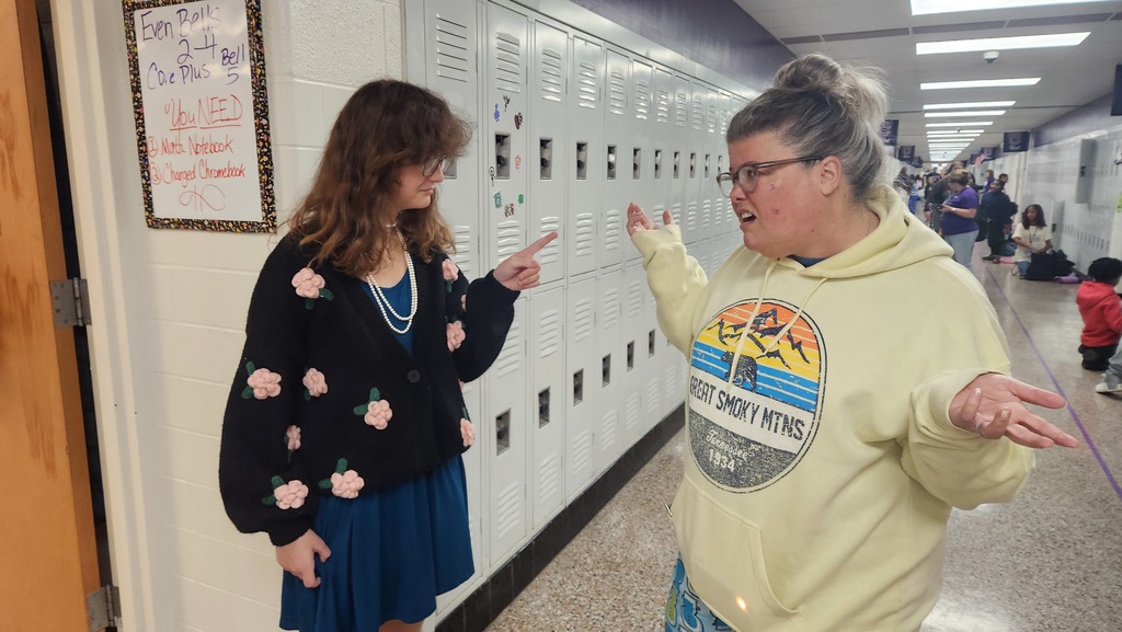 A student dressed like a teacher reprimanding a teacher dressed as a student