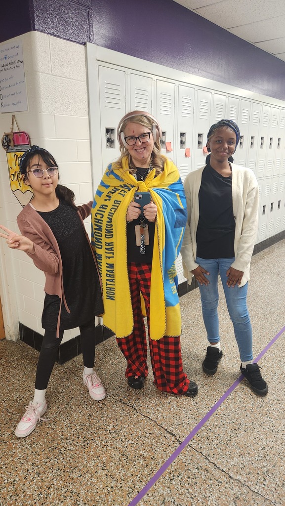 two students dressed like teachers and a teacher dressed as a student