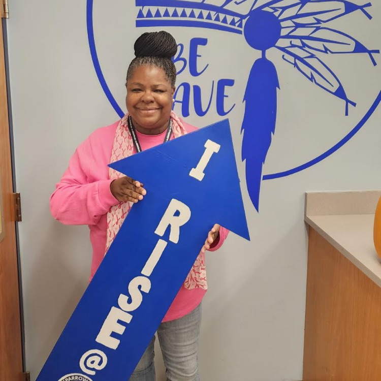 staff with I RIsE sign