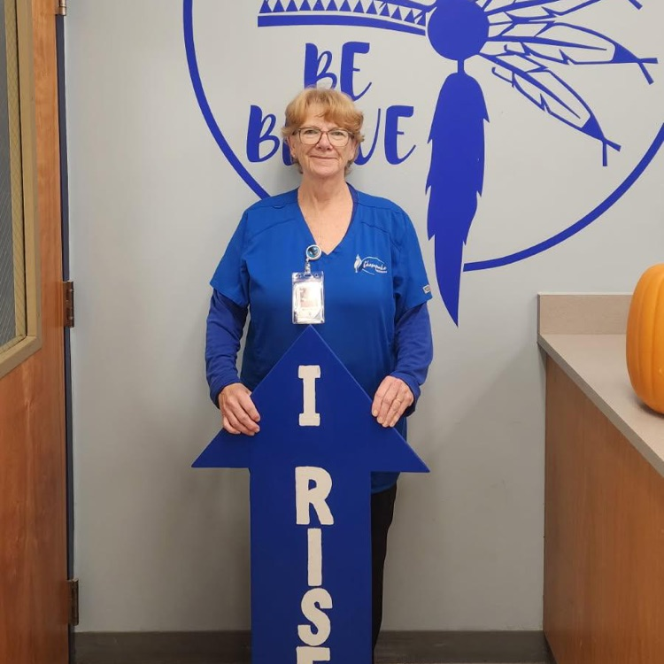 staff with I RIsE sign