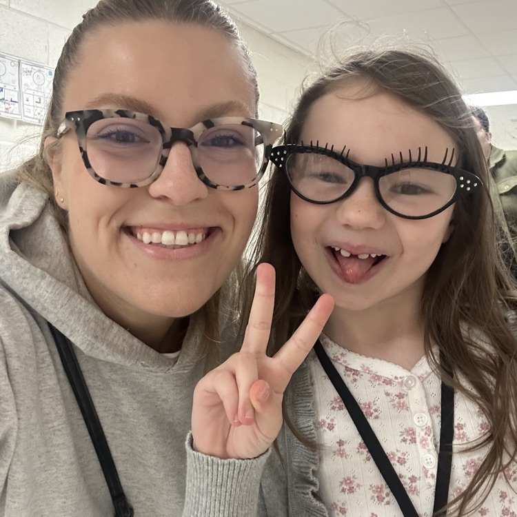 teacher and student twinning with eyeglasses