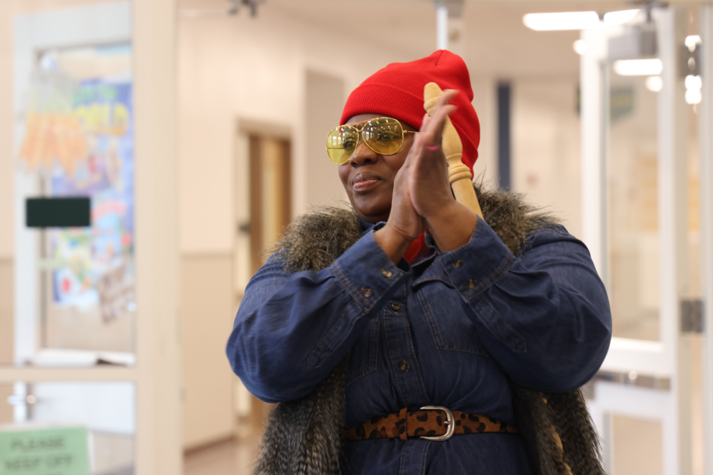 Lunch worker smiling and clapping